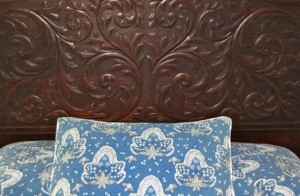Waipio Wayside, Plantation Room, decorative pillow in front of ornate headboard